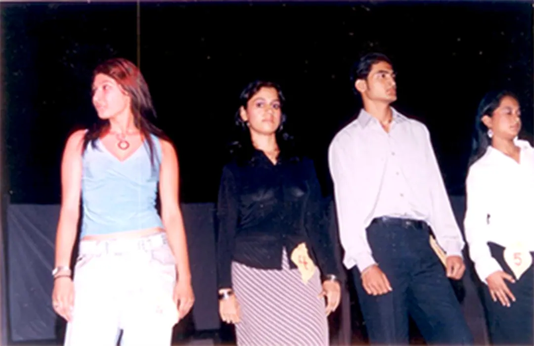 Four people line up for a fashion show